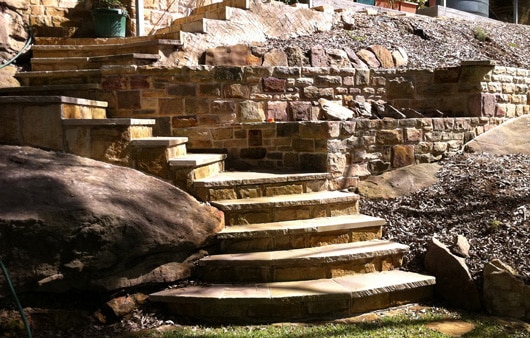 sandstone-retaining-walls-garden-beds-after